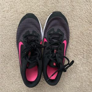 Black and hot pink Nike shoes